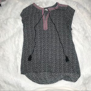 Black top with multicolored detail.